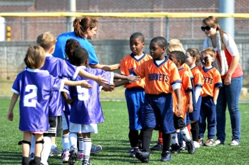 Kids shaking hands after a match
